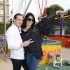 Ludovic Chancel (le fils de Sheila) et sa femme Sylvie Ortega Munos participent à l'ouverture de la fête des Tuileries 2014 à Paris, le 27 juin 2014.