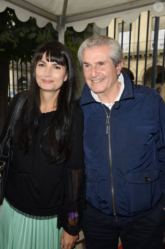 Claude Lelouch et sa compagne Valérie Perrin participent à l'ouverture de la fête des Tuileries 2014 à Paris, le 27 juin 2014.
