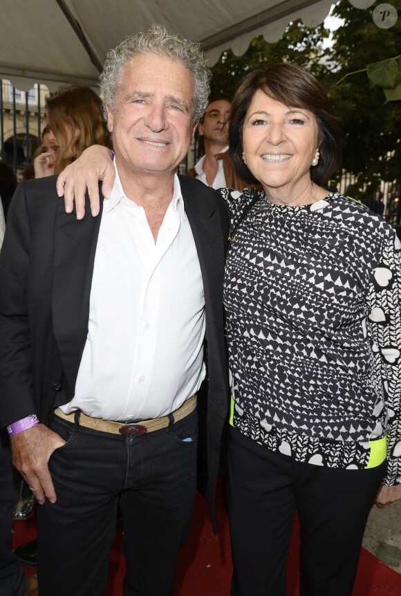 Laurent Dassault et sa femme participent à l'ouverture de la fête des Tuileries 2014 à Paris, le 27 juin 2014.