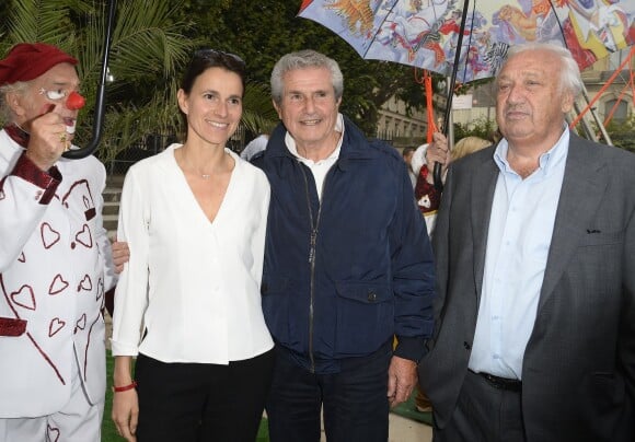 Claude Lelouch, Aurélie Filippetti et Marcel Campion participent à l'ouverture de la fête des Tuileries 2014 à Paris, le 27 juin 2014.