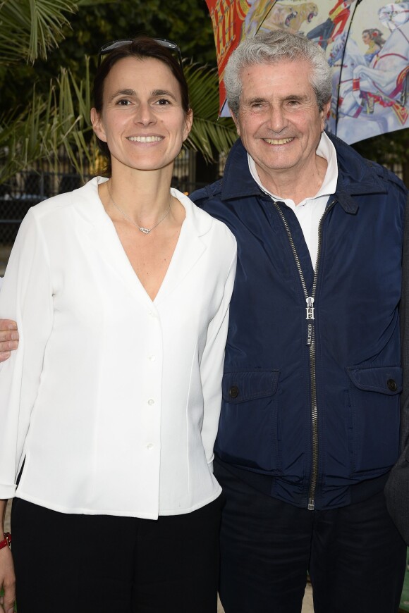Aurélie Filippetti et Claude Lelouch participent à l'ouverture de la fête des Tuileries 2014 à Paris, le 27 juin 2014.