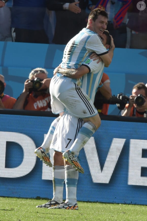 Argentina's Lionel Messi and Angel Di Maria joy after the second scored the 1-0 decisive goaln Soccer World Cup 2014 1/8 of Final round match Argentina vs Switzerland in Arena Stadium, Sao Paulo, Brasil on July 1st 2014. Argentina won 1-0 (after extra time). Photo by Henri Szwarc/ABACAPRESS.COM01/07/2014 - Sao Paulo