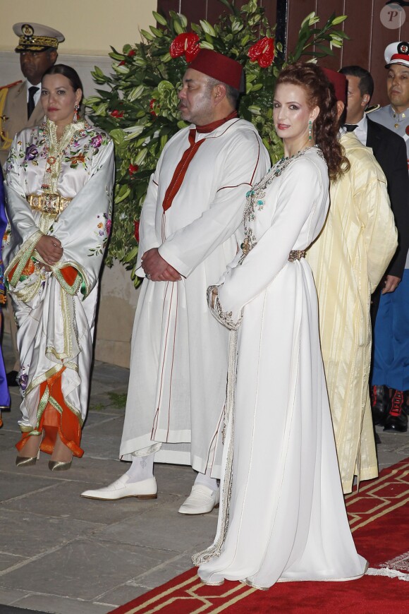 Mohammed VI et Lalla Salma du Maroc lors de l'iftar offert le 14 juillet 2014 au palais royal à Rabat pour la visite inaugurale du roi Felipe VI d'Espagne et son épouse.
