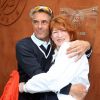 Gérard Holtz et sa femme Muriel Mayette au tournoi de Roland-Garros à Paris, le 29 mai 2014.