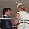 Zara Phillips profite de la compagnie de Tom Cruise à l'hippodrome Goodwood de Chichester, le 31 juillet 2014, lors du Ladies Day de la réunion hippique Glorious Goodwood.
