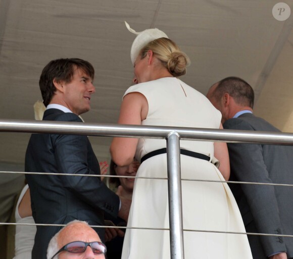 Zara Phillips profite de la compagnie de Tom Cruise à l'hippodrome Goodwood de Chichester, le 31 juillet 2014, lors du Ladies Day de la réunion hippique Glorious Goodwood.