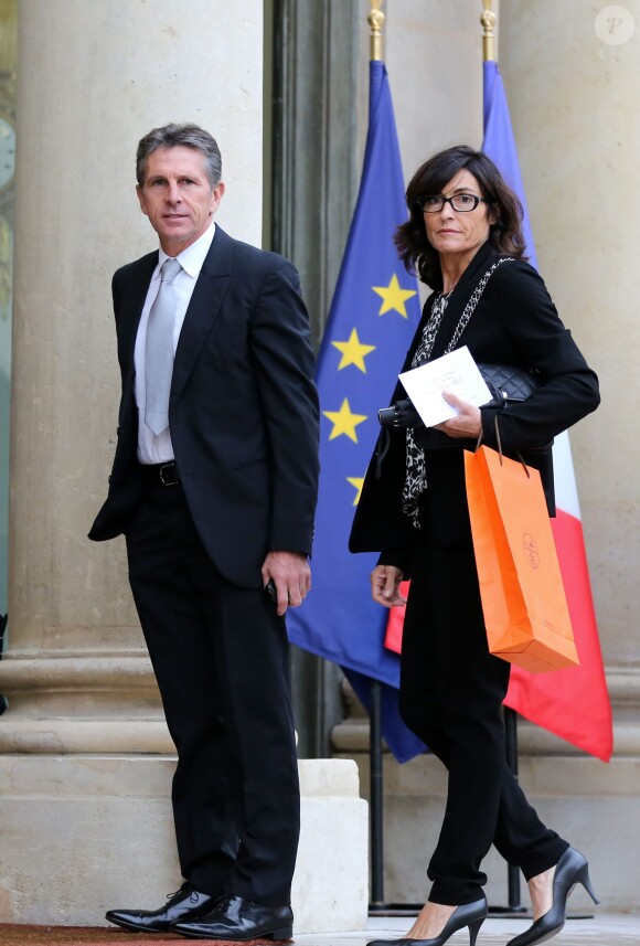 Claude Puel et sa femme à l'Elysée le 9 octobre 2013 pour une cérémonie de remise de décorations par le président François Hollande