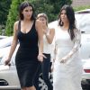 Kim et Kourtney Kardashian sont passées dans leur boutique éphémère DASH, dans les Hamptons. Southampton, le 12 août 2014.