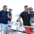 Elton John, son compagnon David Furnish et leurs fils Elijah et Zachary se sont rendus sur le yacht de Lily Safra dans le port de Saint-Tropez, le 19 août 2014