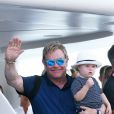 Le chanteur Elton John, son compagnon David Furnish et leurs fils Elijah et Zachary se sont rendus sur le yacht de Lily Safra dans le port de Saint-Tropez, le 19 août 2014