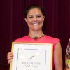 Rayonnante, la princesse Victoria de Suède, en présence du prince Daniel, a remis le 20 août 2014 le prix de l'Association des Suédois dans le monde à Martin Lorentzon, cofondateur de Spotify, lors d'un repas de gala au Grand Hotel de Stockholm.