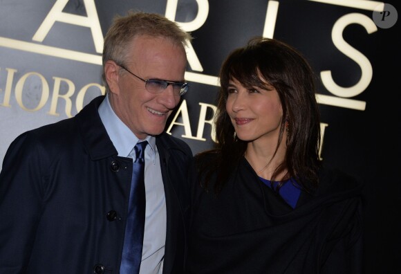 Sophie Marceau et son compagnon Christophe Lambert au défilé Giorgio Armani Haute Couture à Paris, le 21 janvier 2014