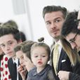  David Beckham et ses quatre enfants Brooklyn, Romeo, Cruz et Harper lors du d&eacute;fil&eacute; Victoria Beckham automne-hiver 2014-2015. New York, le 9 f&eacute;vrier 2014. 