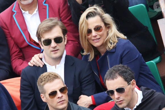 Laurence Ferrari et son mari Renaud Capuçon dans les tribunes du tournoi de Roland-Garros, le 9 juin 2013.