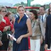 La princesse Charlene, enceinte de son premier enfant, et le prince Albert II de Monaco lors du traditionnel pique-nique des Monégasques dans les jardins du parc Princesse-Antoinette à Monaco, le 1er septembre 2014.