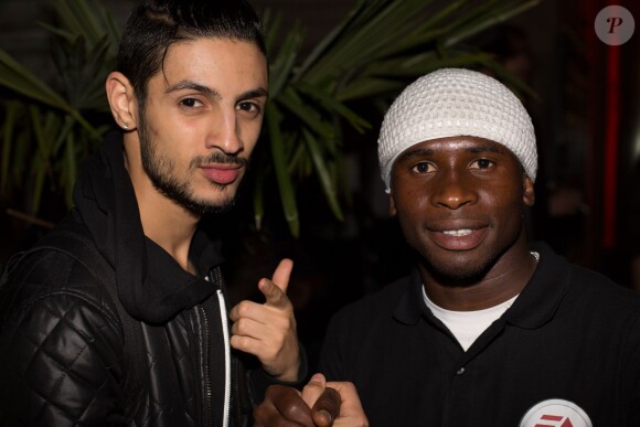 Elvisi et Iya Traoré - Soirée de lancement du jeu vidéo "FIFA 2015" à l'Opéra Garnier Restaurant à Paris le 22 septembre 2014.