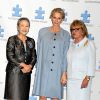 La princesse Charlene de Monaco, enceinte de son premier enfant, entourée de Ban Soon-taek, épouse de Ban Ki-moon, et de Suzanne Wright, cofondatrice de l'association Autism Speaks, à l'hôtel Hilton de New York le 25 septembre 2014 pour le 7e Focus mondial annuel sur l'autisme.