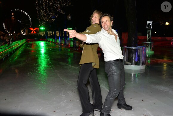 Philippe Candeloro et Gwendal Peizerat - Hommage aux musiques de film de Jean-Paul Belmondo à l'occasion de l'inauguration du marché de Noël 2014 sur les Champs-Elysées à Paris, le 14 novembre 2014.