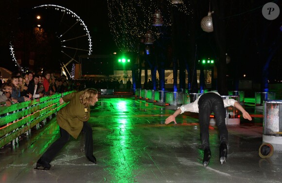 Philippe Candeloro et Gwendal Peizerat - Hommage aux musiques de film de Jean-Paul Belmondo à l'occasion de l'inauguration du marché de Noël 2014 sur les Champs-Elysées à Paris, le 14 novembre 2014.