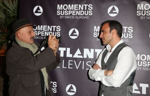 Exclusif - Nikos Aliagas et le photographe Reza Deghati - Vernissage de l'exposition "Moments Suspendus" de Nikos Aliagas à l'Atlantis TV à Boulogne-Billancourt, le 3 décembre 2014.
