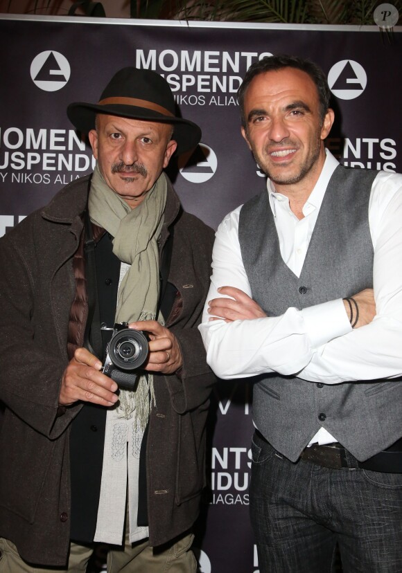 Exclusif - Nikos Aliagas et le photographe Reza Deghati - Vernissage de l'exposition "Moments Suspendus" de Nikos Aliagas à l'Atlantis TV à Boulogne-Billancourt, le 3 décembre 2014.