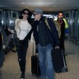 George Clooney et sa femme Amal Alamuddin quittant l'aéroport de Londres le 27 novembre 2014.