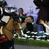 Marion Cotillard complice et tendre avec son fils Marcel devant Guillaume Canet au quatrième jour des Gucci Paris Masters 2014 à Villepinte le 7 décembre 2014