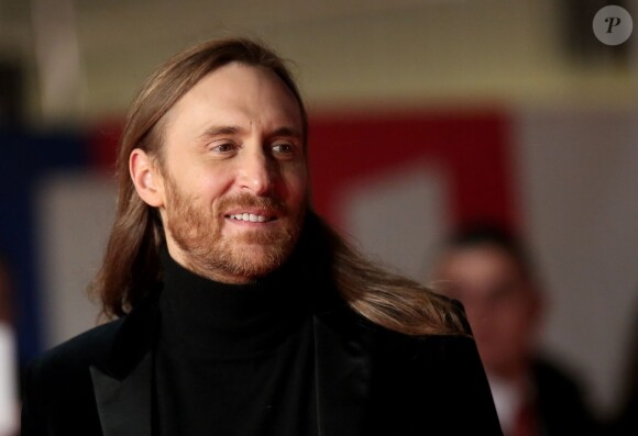 David Guetta, sur le tapis rouge de la 16e édition des NRJ Music Awards à Cannes, le samedi 13 décembre 2014.