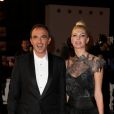 Nikos Aliagas et sa compagne Tina Grigoriou, sur le tapis rouge de la 16e édition des NRJ Music Awards à Cannes, le samedi 13 décembre 2014.