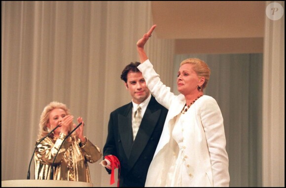 Jean Moreau, John Travolta et Virna Lisi lors du Festival de Cannes 1994