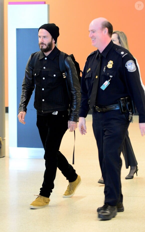 David Beckham arrive à l'aéroport de Miami, le 22 mars 2015.
