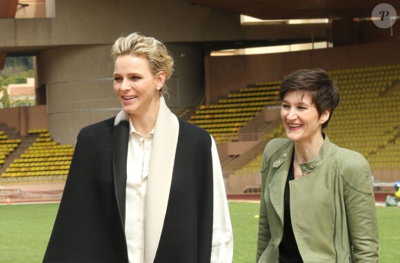 La Princesse Charlène de Monaco et Agnès Falco, secrétaire générale de la Fondation de la princesse, lors de la 5e édition du "Tournoi Sainte-Dévote" organisé par la Fondation Princesse Charlène de Monaco et la Fédération Monégasque de Rugby au Stade Louis II à Monaco, le samedi 11 avril 2015.