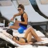 Nikki Reed et Ian Somerhalder, en lune de miel au Brésil prennent le soleil sur la terrasse de leur hôtel Fasano avec Phoebe Tonkin qui n'est autre que la petite-amie de Paul Wesley , le 8 mai 2015