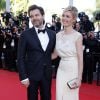 Clovis Cornillac et sa femme Lilou Fogli (robe Alexis Mabille, talons Inga et pochette Roger Vivier) - Montée des marches du film "Inside Out" (Vice-Versa) lors du 68e Festival International du Film de Cannes, le 18 mai 2015.