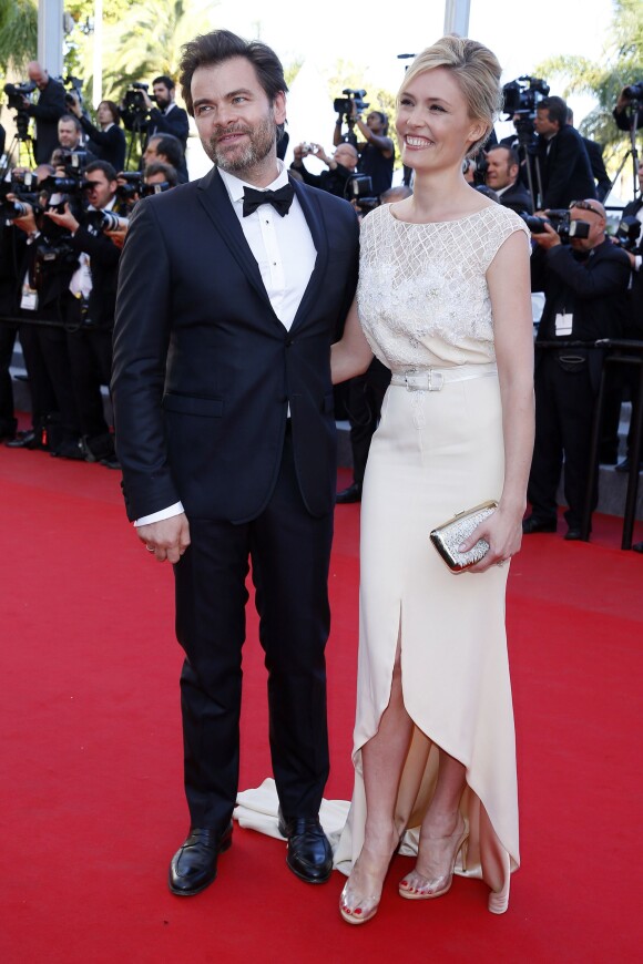 Clovis Cornillac et sa femme Lilou Fogli (robe Alexis Mabille, talons Inga et pochette Roger Vivier) - Montée des marches du film "Inside Out" (Vice-Versa) lors du 68e Festival International du Film de Cannes, le 18 mai 2015.