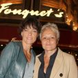  Exclusif - Muriel Robin et sa compagne Anne Le Nen, lors du 70e anniversaire de Catherine Lara au Fouquet's à Paris le 30 mai 2015. 
