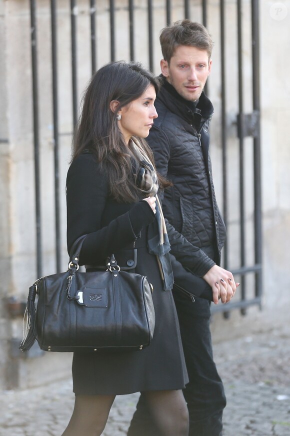 Romain Grosjean et sa femme Marion Jollès lors de la messe en hommage à Christophe de Margerie en l'église Saint-Sulpice à Paris le 27 octobre 2014