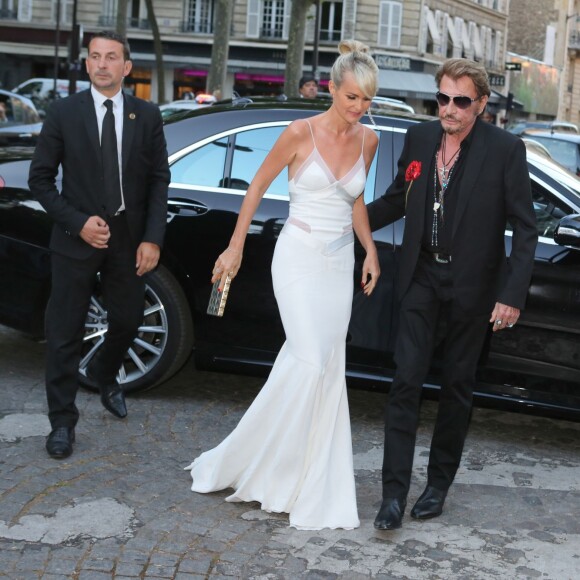 Johnny Hallyday et sa femme Laeticia Hallyday à la soirée "Vogue Paris Foundation Gala" au palais Galliera à Paris, le 6 juillet 2015.