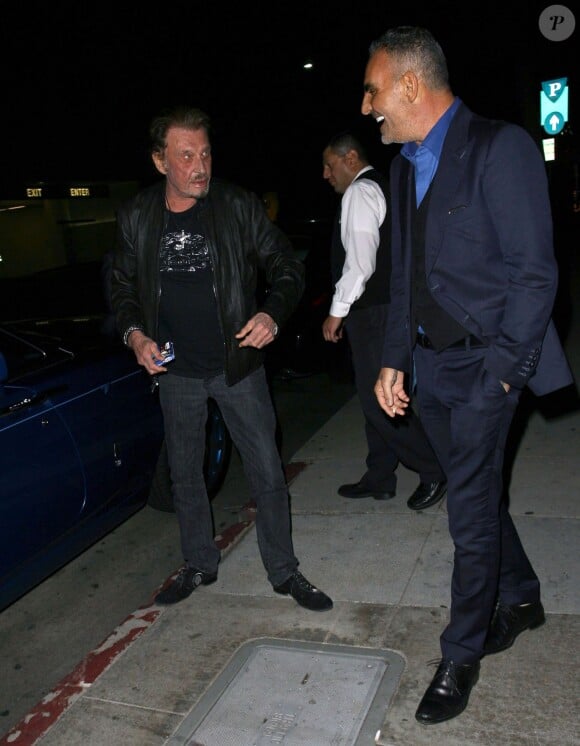 Johnny Hallyday et Christian Audigier au restaurant Mr Chow à Los Angeles le 23 janvier 2015