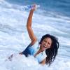 Caya Hefner (épouse de Keith Hefner et belle-soeur de Hugh Hefner) surprise en plein shooting pour 138 Water sur une plage de Malibu, le 27 juillet 2015.