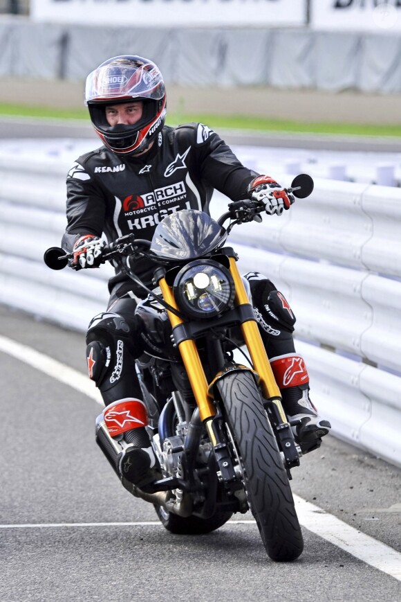 Keanu Reeves essaye sa moto à Suzuka au Japon le 25 Juillet 2015.