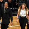 Jay Z et Beyoncé, habillée d'une chemise Tanya Taylor et d'une jupe Herve Leger, au Barclays Center à Brooklyn. Le 9 décembre 2014.