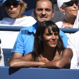 Shy'm, tout sourire devant Benoît Paire et son huitième de finale de l'US Open, à l'USTA Billie Jean King National Tennis Center de Flushing dans le Queens à New York, le 6 septembre 2015