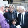 Grégoire Vitry (le fils de Sylvie Joly), son fils Antonin et Pierre Vitry (le mari de Sylvie Joly) - Sortie des obsèques de Sylvie Joly en l'église Saint-Sulpice à Paris. Le 9 septembre 2015.