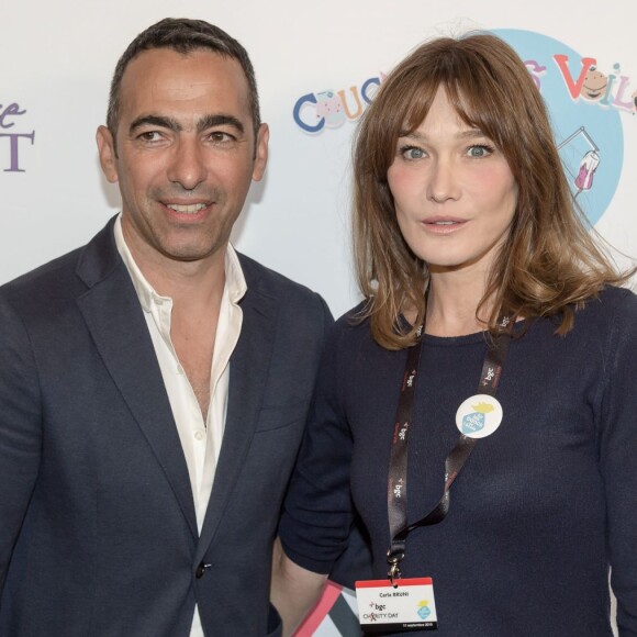 Youri Djorkaeff et Carla Bruni Sarkozy - 11e édition du "BGC Charity Day" à Paris le 11 septembre 2015 en mémoire aux 658 collaborateurs du groupe BGC Partners (leader mondial du courtage interbancaire) disparus dans les attentats du World Trade Center, le 11 septembre 2001.