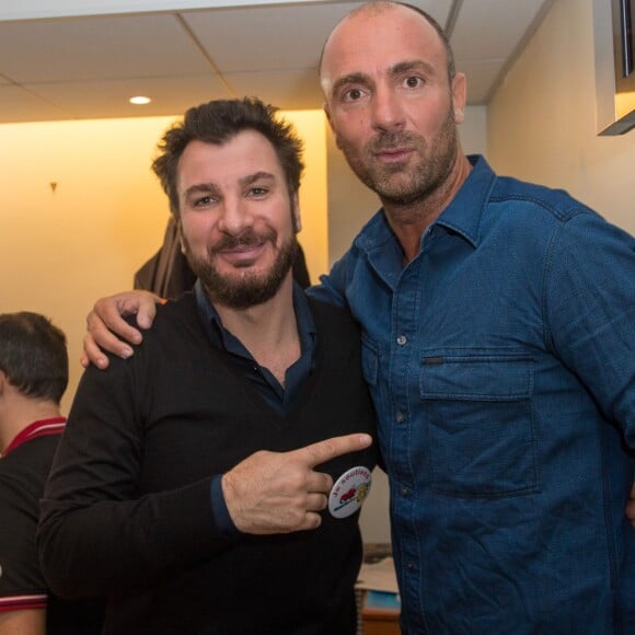 Michaël Youn et Christophe Dugarry - 11e édition du "BGC Charity Day" à Paris le 11 septembre 2015 en mémoire aux 658 collaborateurs du groupe BGC Partners (leader mondial du courtage interbancaire) disparus dans les attentats du World Trade Center, le 11 septembre 2001.