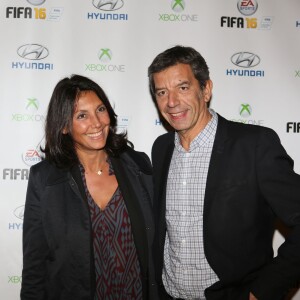 Michel Cymes et sa femme Nathalie - Soirée de lancement du jeu vidéo "FIFA 2016" au Faust à Paris, le 21 septembre 2015