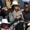 Djibril Cissé et sa compagne Marie-Cécile Lenzini dans les tribunes des Internationaux de France de tennis de Roland-Garros à Paris le 1er juin 2015
