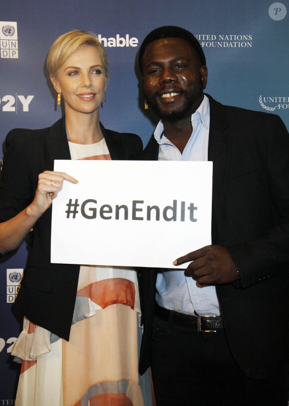 Charlize Theron, Kweku Mandela à la soirée 2015 Social Good Summit à New York, le 28 septembre 2015