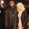 Kanye West, habillé d'un manteau Lanvin et d'un pull Vetements, assiste avec sa femme Kim Kardashian au défile Lanvin à Paris, le 5 mars 2015.